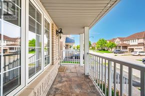 Brampton (Fletcher's Meadow) apartment for rent - A view from a porch looking towards a street with cars and houses.