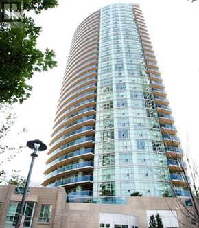 Mississauga (City Centre) condo for rent - A tall building with many windows and balconies is under construction.