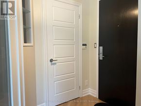Mississauga (City Centre) condo for rent - A white door with a black door on the other side.