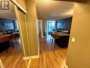 Mississauga (City Centre) condo for rent - A billiards table is in the middle of a room with a pool table and a shelf.