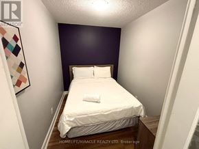 Mississauga (City Centre) condo for rent - A room with a grey curtain and a green carpet.