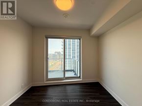 Markham (Commerce Valley) condo for rent - A room with a large window and a wooden floor.