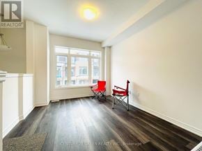 Hamilton (Parkview) townhouse for rent - A room with a window and two chairs.