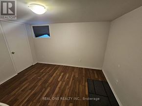 Hamilton (Ainslie Wood) apartment for rent - A room with wooden flooring and a window with a view of the sky.