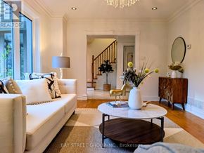 Toronto (Don Valley Village) apartment for rent - A living room with a white sofa, a coffee table, and a chandelier.