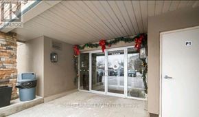 Brampton (Goreway Drive Corridor) condo for rent - A home office with a window and a door is decorated for Christmas.