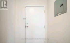 Brampton (Goreway Drive Corridor) condo for rent - A white door with a handle and a lock is closed.