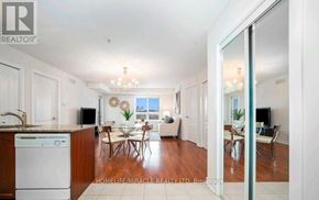 Brampton (Goreway Drive Corridor) condo for rent - A well-lit, spacious kitchen and dining area with a view of the living room.