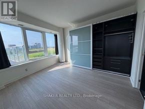 Ottawa condo for rent - A room with a large window and a sliding door.