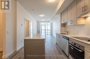 Hamilton (Lakeshore) condo for rent - A kitchen with a stove top oven and a dishwasher.