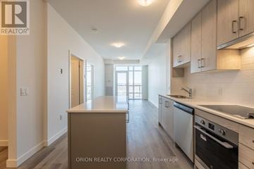 Hamilton (Lakeshore) condo for rent - A kitchen with a stove top oven and a dishwasher.