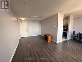 Toronto (Dorset Park) condo for rent - A room with wooden flooring and a white door.