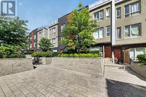 Toronto (Malvern) townhouse for rent - A sunny day at a brick building with a paved courtyard.