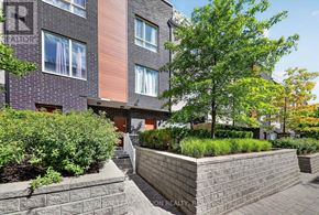 Toronto (Malvern) townhouse for rent - A brick building with a tree in front.