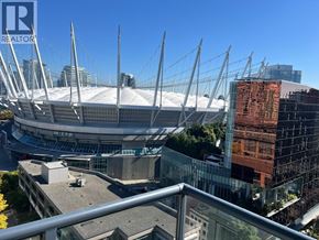 Vancouver apartment for rent - A large stadium with a glass facade building in the background.