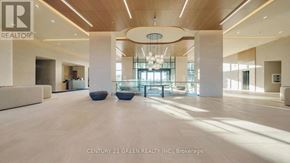 Vaughan (Vellore Village) condo for rent - A spacious lobby with a wooden ceiling and a chandelier hangs from the center.
