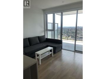 Burnaby apartment for rent - A living room with a grey couch and a coffee table.