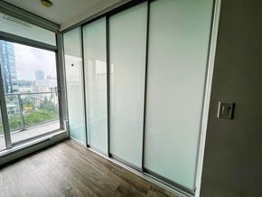 Surrey apartment for rent - A room with a window and a wooden floor.