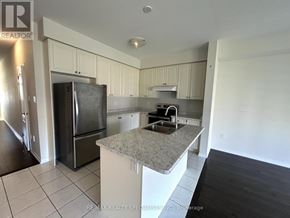 Niagara Falls (Brown) apartment for rent - A kitchen with a granite countertop and stainless steel appliances.