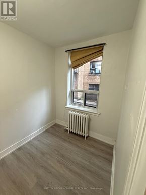 Toronto (Yonge-Eglinton) multi-family for rent - A room with a window and a radiator on the floor.