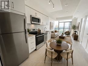 Toronto (Humber Heights) condo for rent - A modern kitchen with a refrigerator, microwave, oven, and sink.