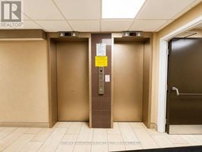 Niagara Falls (Stamford) condo for rent - Two elevators in a hallway with a sign on the door.