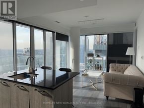 Toronto (Church-Yonge Corridor) condo for rent - A modern kitchen with a view of the cityscape.