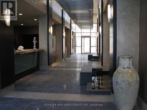 Markham (Unionville) condo for rent - A hallway with a large vase on the right side.