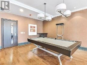 Markham (Unionville) condo for rent - A pool table in a room with a light brown wall and a door.