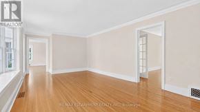 Burlington (Roseland) apartment for rent - A room with wooden floors and white walls.