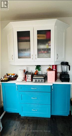 Oshawa (Mclaughlin) apartment for rent - A kitchen with white cabinets and a blue counter.