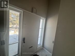Brampton (Brampton South) apartment for rent - A room with a door and a window.