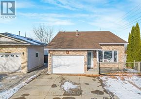 Welland (N. Welland) apartment for rent - A house with a brown roof and a white garage door is for sale.