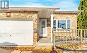 Welland (N. Welland) apartment for rent - A house with a white garage door and a brick wall.