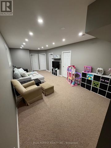 London East (East I) apartment for rent - A living room with a grey carpet and a white sofa.