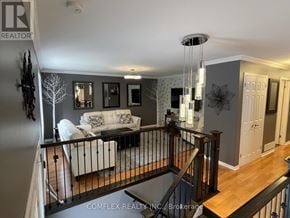 Oshawa (Centennial) apartment for rent - A living room with a white couch and a grey wallpaper.