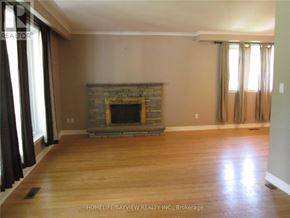 Newmarket (Central Newmarket) apartment for rent - A living room with a fireplace and wood floors.