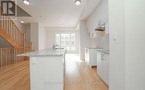 Oakville (Jm Joshua Meadows) townhouse for rent - A modern kitchen with white appliances and wooden floors.