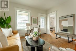 Hamilton (Hamilton Beach) apartment for rent - A living room with a couch, coffee table, and a painting on the wall.