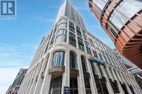 Toronto (Waterfront Communities) condo for rent - A tall building with a pointed top and a sign that reads "Royal Exchange".
