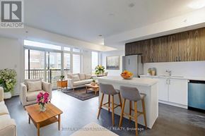 Ajax (Central) townhouse for rent - A well-lit, modern kitchen and living room with a dining area.