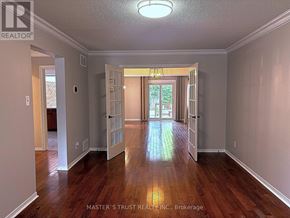 Oakville (Fd Ford) apartment for rent - A spacious room with wood flooring and a chandelier hanging from the ceiling.