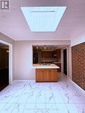 Oakville (Fd Ford) apartment for rent - A kitchen with a marble floor and a skylight.