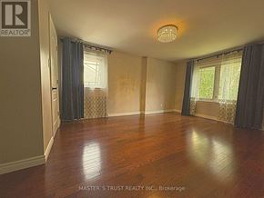 Oakville (Fd Ford) apartment for rent - A room with wooden floors and a ceiling light.