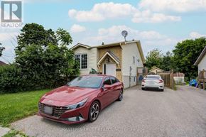 Oshawa (Farewell) apartment for rent - A red car is parked in front of a house with a satellite dish on the roof.