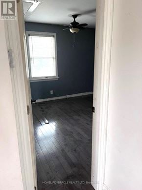 Oshawa (Central) apartment for rent - A room with a ceiling fan and a window.
