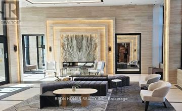 Toronto (Etobicoke West Mall) condo for rent - A modern living room with a large abstract painting on the wall.