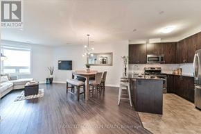 Markham (Middlefield) condo for rent - A well-lit kitchen and dining area with wooden floors and modern appliances.