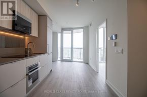 Mississauga (Mississauga Valleys) condo for rent - A spacious kitchen with a microwave, oven, and a sink.