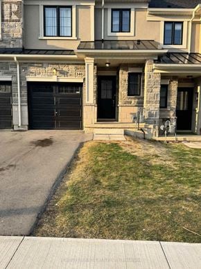 Hamilton (Ryckmans) townhouse for rent - A house with a stone facade and a black door.